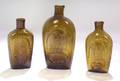 Three OliveAmber Blown Molded Glass Flasks