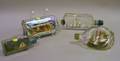 Four Folk Painted Ships in Bottles