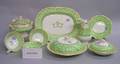 Sixtysix Piece European Gilt and Green Pattern Decorated Porcelain Partial Dinner Service