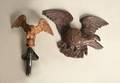 Two carved eagle ornaments