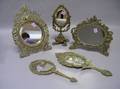 Three Cast Brass Table Mirrors and Two Cast Brass Hand Mirrors