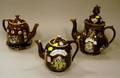 Three Measham Bargeware Teapots and a Trivet