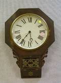 New Haven Clock Co Octagonal Mahogany Veneer Wall Clock