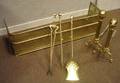 Georgianstyle Pierced Brass Fireplace Fender a Set of Three Brass Tools and a Pair of Brass Balltop RopeTurned Andirons