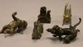 Four Small Asian Bronze Figures and a Carved Stone Seal
