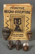 Five Miniature African Carved Wood Masks and a Book