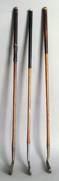 Three early golf putters