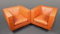 Pair of Verdesign Orange Leather Armchairs