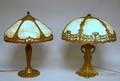 Two Painted Cast Metal Overlay and Bent Caramel Slag Glass Table Lamps