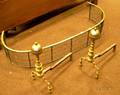 Pair of Brass Belted Balltop Andirons and a Brass and Wire Cshaped Fireplace Fender