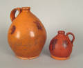 Two redware ovoid jugs 19th c