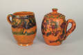 Two redware mugs 19th c