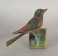 Carved and painted bird on a perch early 20th c
