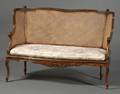 Louis XV Style Carved Walnut and Caned Settee