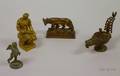 Three Classical and Archaictype Bronze Figures and an Oil Lamp