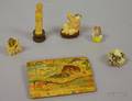 Five Asian Carved Ivory and Ivorytype Figures and Netsuke and a Polychrome Decorated Pigskin Purse