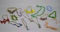 Fourteen Assorted Art Deco and Later Costume Necklaces