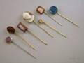 Seven Carved Hardstone or Glass Cameo Stickpins