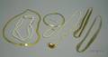 Two 14kt Gold Necklaces a 14kt Gold and a Sterling Silver Multi Strand Necklace a Strand of Potato Pearls wit