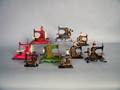 Nine tin toy sewing machines