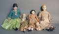 Four bisque head and shoulder dolls