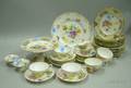 Thirtyfour Pieces of Mostly Dresden Gilt and Handpainted Floral Decorated Porcelain Tableware