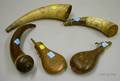 Three Decorated Powder Horns and Two Embossed Copper and Leather Powder Flasks