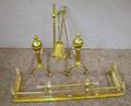 Brass Cast and Twist Fireplace Fender a Pair of Balltop Twist Andirons and a Brass Stand with Three ToolsD