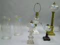 Four Glass Oil Table Lamps and a Pair of Colorless Etched Glass Hurricane Shades