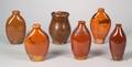 Five Glazed Redware Bottles Flasks and a Covered Jar