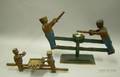 Folk Carved Wooden Articulated PushPull Figural Bakers Making Bread Toy and a Figures Hammering Toy