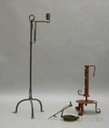 Brass Betty Lamp a Redpainted Wrought Iron Adjustable Footed Candleholder and a Wrought Iron Adjustable Cand