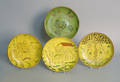 Four Breininger sgraffito redware plates