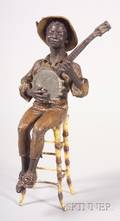 Cold Painted White Metal Figure of a Banjo Player
