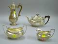 Threepiece Silver Plated Tea Set and a Silver Plated Demitasse Pot