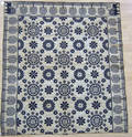 Blue and white jacquard coverlet