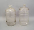 Two blown glass canisters
