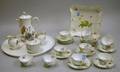 Twentyeight Piece Handpainted Floral Decorated Porcelain Demitasse Set and a Meissen Handpainted Lemon and F