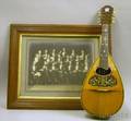 Ditson Victory Inlaid Mandolin and a Framed Circa 1920s Albumen Portrait Photograph of a Band