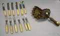 Iron and Bronze Floralform Mold and a Set of Twelve Bonehandled Knives and Forks