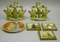 Mettlach Etched Plaque Three Delft Glazed Pottery Tiles and a Pair of Bisque Water Carrier Figural Vases