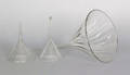 Three blown colorless glass funnels early 19th c
