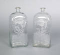 Pair of Stiegel type etched colorless glass bottles ca 1800