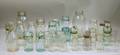 Seventeen Aqua and Colorless Glass Canning Jars and Eleven Assorted Milk and Dairy Bottles