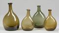 Four Small Freeblown Colored Glass Chestnut Bottles