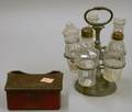 Trask Pewter Five Bottle Caster Set and an Iron lifttop Inkwell