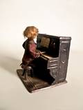Tin wind up piano player by Systeme