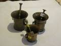 Three Brass Mortars and Pestles