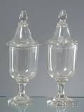 Pair of Blown Clear Glass Footed Jars