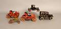 Five early tin toy cars